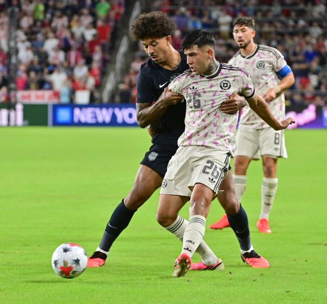 US defender #03 Chris Richards and Chile's defender #26 Diego Ulloa vie for the ball during the international friendly football match between USA and Chile at Energizer Park in St. Louis, Missouri, on September 29, 2026. (Photo by TIM VIZER / AFP)