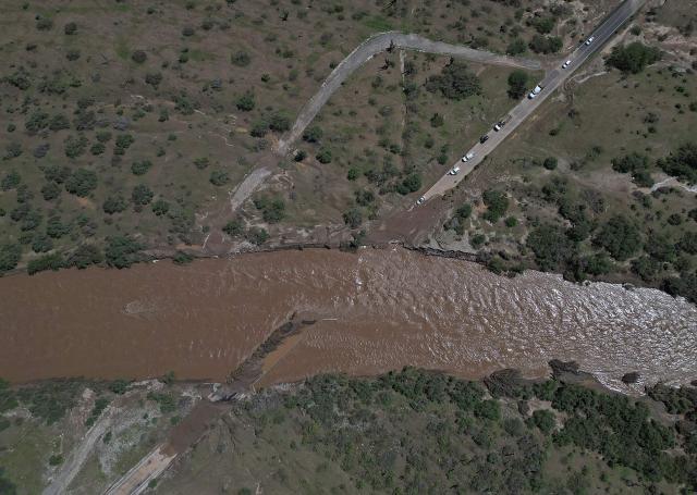 Aerial view of a road washed away after the arrival of Hurricane Polo near las Barrancas, Baja California Sur, Mexico on September 29, 2026. Hurricane Polo made landfall on Mexico's Baja California peninsula on September 29, cutting power and causing flooding as the sea breached coastal defenses. The Category 3 storm is the latest in a busy storm season turbo-charged by the El Nino weather phenomenon, which has caused unprecedented warming in the equatorial Pacific. (Photo by Carl de Souza / AFP)