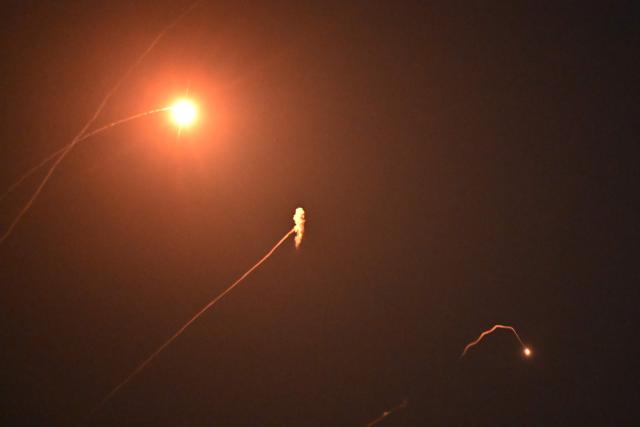 Ukraine's air defences are seen in action during a missile and drone strike on Kyiv amid the Russian invasion of Ukraine early on September 30, 2026. (Photo by Sergei SUPINSKY / AFP)