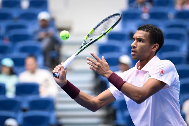 Canada's Felix Auger-Aliassime hits a return to Russia's Karen Khachanov during their men's singles first round at the China Open tennis tournament in Beijing on September 30, 2026. (Photo by WANG Zhao / AFP)