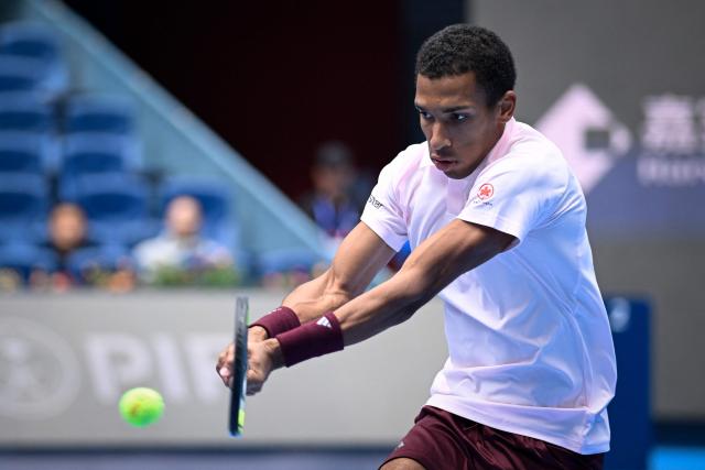 Canada's Felix Auger-Aliassime hits a return to Russia's Karen Khachanov during their men's singles first round at the China Open tennis tournament in Beijing on September 30, 2026. (Photo by WANG Zhao / AFP)