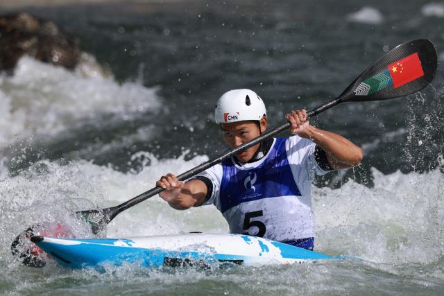 China's Hu Zhaoshan competes in the men's kayak single final in the canoe slalom event during the 2026 Asian Games at the Yahagigawa Canoe Slalom Course in Toyota on September 30, 2026. (Photo by DAVID GRAY / AFP)