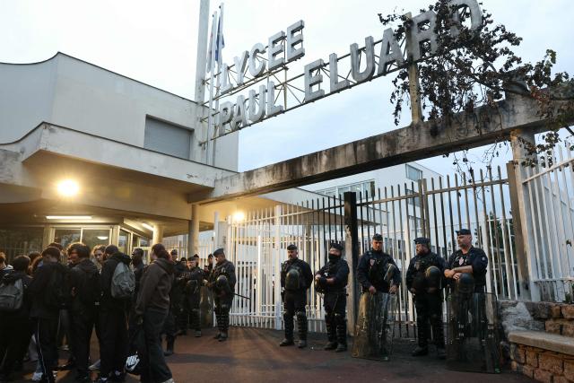 French riot police stand guard in front of Paul Eluard secondary school as students continue their blocking protest to demand the hiring of substitute teachers, increased resources, and decent learning conditions. in Saint-Denis, North of Paris, on September 30, 2026. (Photo by Thomas SAMSON / AFP)