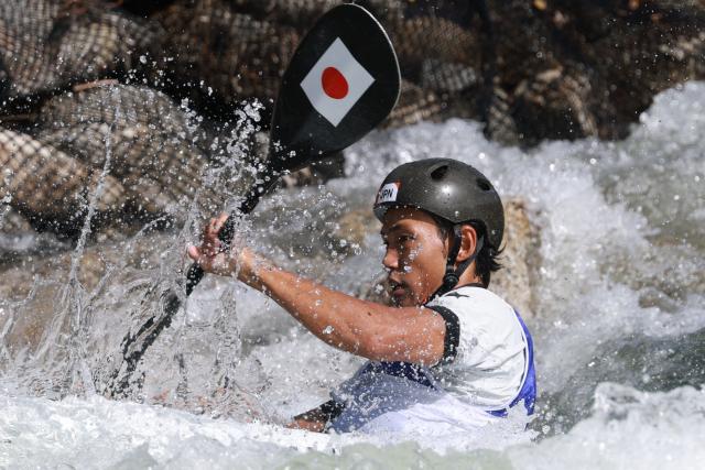 Japan's Yuuki Tanaka competes in the men's kayak single final in the canoe slalom event during the 2026 Asian Games at the Yahagigawa Canoe Slalom Course in Toyota on September 30, 2026. (Photo by DAVID GRAY / AFP)