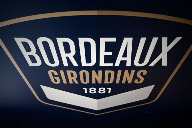 (FILES) The logo of the Girondins de Bordeaux football clubis pictured during a press conference at the club's training ground in Le Haillan, near Bordeaux, on May 6, 2021. A sale agreement between Girondins de Bordeaux—which was administratively relegated to the regional division—and the British investment fund Park Bench was signed on September 30, 2026, the club said, adding that it should thus avoid bankruptcy. (Photo by Philippe LOPEZ / AFP)