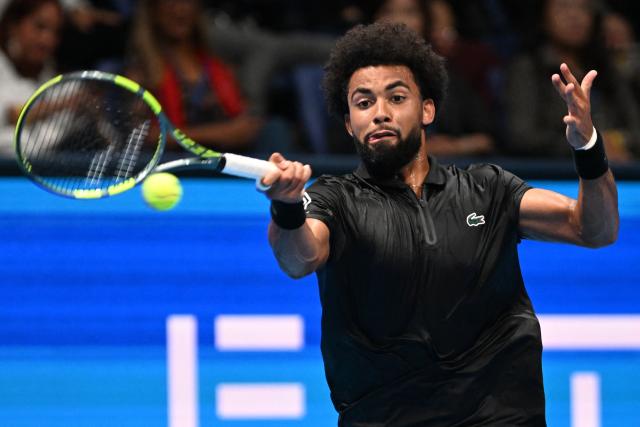 France's Arthur Fils plays a shot to France's Luca van Assche during their men's singles tennis match at the ATP Tour Japan Open Tennis Championships at the Ariake Tennis Forest Park in Tokyo on September 30, 2026. (Photo by Rie KIKUCHI / AFP)