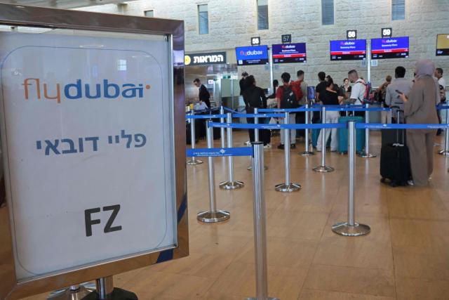 Passengers queue at the flydubai counters in Ben Gurion Airport near Tel Aviv on September 30, 2026. The emergency landing on September 30 of a Tel Aviv-bound flydubai flight was due to a "terrorist" who wanted to crash the plane and kill Israelis, Israel's far-right national security minister said. (Photo by Jack GUEZ / AFP)