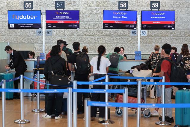 Passengers queue at the flydubai counters in Ben Gurion Airport near Tel Aviv on September 30, 2026. The emergency landing on September 30 of a Tel Aviv-bound flydubai flight was due to a "terrorist" who wanted to crash the plane and kill Israelis, Israel's far-right national security minister said. (Photo by Jack GUEZ / AFP)