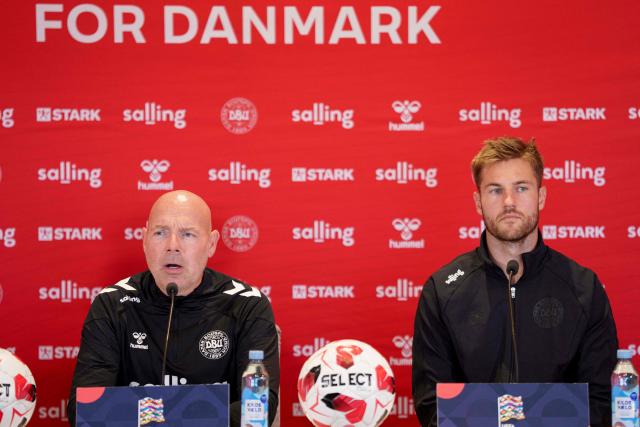 Denmark's head coach Brian Riemer (L) and Denmark's defender Joachim Andersen address a press conference in Helsingor on September 29, 2026, on the eve of their Nations League Group A4 match against Portugal. (Photo by Liselotte Sabroe / Ritzau Scanpix / AFP) / Denmark OUT