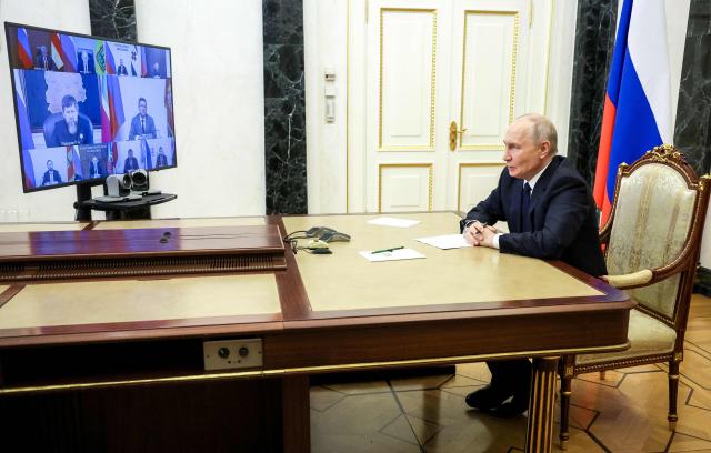 In this pool photograph distributed by the Russian state agency Sputnik, Russia's President Vladimir Putin holds a meeting with newly elected regional governors via video link in Moscow on September 30, 2026. (Photo by Vyacheslav PROKOFYEV / POOL / AFP)