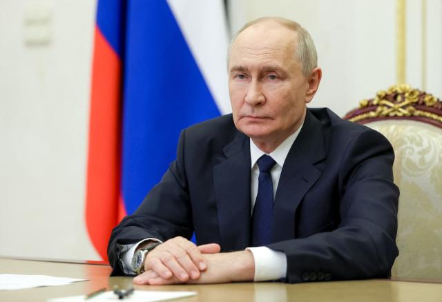 In this pool photograph distributed by the Russian state agency Sputnik, Russia's President Vladimir Putin holds a meeting with newly elected regional governors via video link in Moscow on September 30, 2026. (Photo by Vyacheslav PROKOFYEV / POOL / AFP)