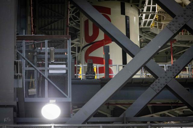 A solid rocket booster of the Space Launch System (SLS) for Artemis III is seen inside the Vehicle Assembly Building (VAB) at Kennedy Space Center, in Cape Canaveral, Florida, on September 30, 2026. Artemis III is an upcoming crewed mission led by the NASA Artemis program, targeting a 2027 launch. (Photo by Marco BELLO / AFP)
