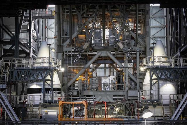 Solid rocket boosters of the Space Launch System (SLS) for Artemis III are seen inside the Vehicle Assembly Building (VAB) at Kennedy Space Center, in Cape Canaveral, Florida, on September 30, 2026. Artemis III is an upcoming crewed mission led by the NASA Artemis program, targeting a 2027 launch. (Photo by Marco BELLO / AFP)