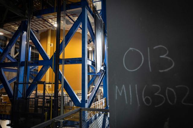 A view of the core stage of the Space Launch System (SLS) for Artemis III inside the Vehicle Assembly Building (VAB) at Kennedy Space Center, in Cape Canaveral, Florida, on September 30, 2026. Artemis III is an upcoming crewed mission led by the NASA Artemis program, targeting a 2027 launch. (Photo by Marco BELLO / AFP)