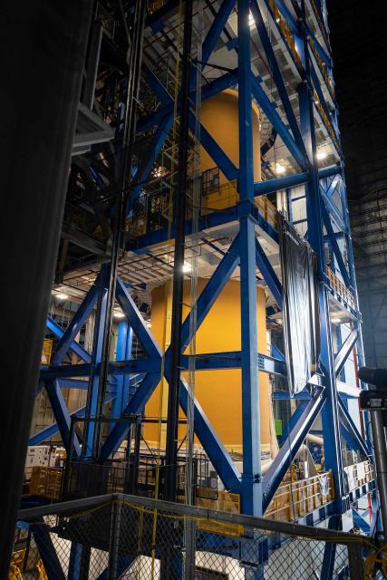 A view of the core stage of the Space Launch System (SLS) for Artemis III inside the Vehicle Assembly Building (VAB) at Kennedy Space Center, in Cape Canaveral, Florida, on September 30, 2026. Artemis III is an upcoming crewed mission led by the NASA Artemis program, targeting a 2027 launch. (Photo by Marco BELLO / AFP)