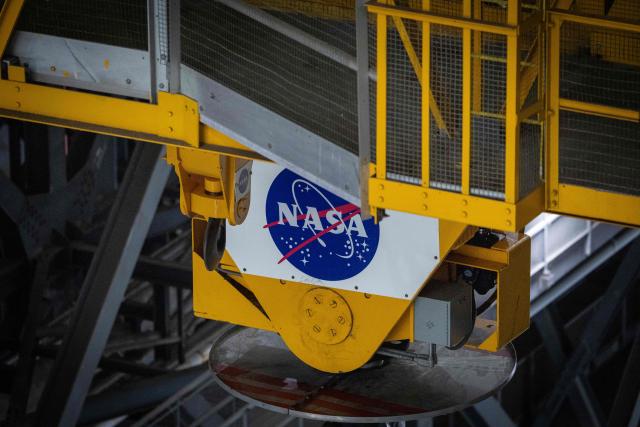 A NASA logo is seen on equipment inside the Vehicle Assembly Building (VAB) at Kennedy Space Center, in Cape Canaveral, Florida, on September 30, 2026. Artemis III is an upcoming crewed mission led by the NASA Artemis program, targeting a 2027 launch. (Photo by Marco BELLO / AFP)