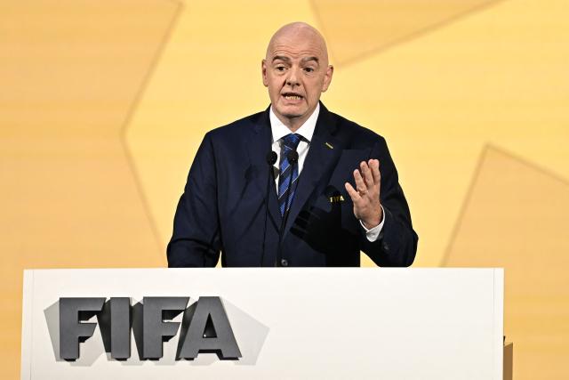 (FILES) FIFA President Gianni Infantino makes a speech during the 74th FIFA Congress in Bangkok on May 17, 2024. The Swiss Football Association announced on September 30, 2026 it was withdrawing its support for  incumbent Gianni Infantino in next year's FIFA presidential election. "We cannot justify continuing to support Gianni Infantino's candidacy," SFV president Peter Knabel said in a statement, citing fundamental questions about leadership, governance and transparency at the top of world football's governing body. (Photo by Manan VATSYAYANA / AFP)