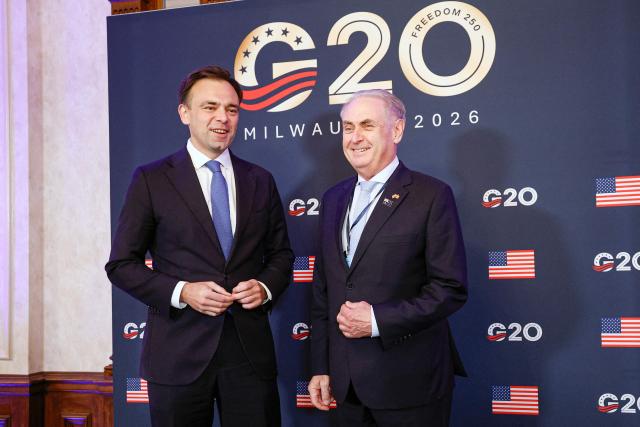 Andrzej Domanski,(L) Poland's Finance Minister meets with Australia's Trade Minister Don Farrell during the first day of the G20 Trade Ministerial Conference in Milwaukee, Wisconsin on September 30, 2026. (Photo by KAMIL KRZACZYNSKI / AFP)
