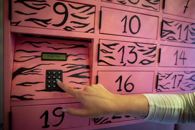 This photo, taken on September 30, 2026, shows activist is entering a code into the “Abortomat” – Poland’s first-ever abortion locker that allows women to access pregnancy-terminating pills anonymously, at the abortion consultation point “Abotak,” located across the street from the entrance to the Polish parliament in Warsaw. Polish activists have opened the country's first-ever abortion locker, allowing women to access pregnancy-terminating pills anonymously and immediately in the country with some of Europe's strictest abortion laws, an activist told AFP on September 30, 2026. (Photo by Wojtek RADWANSKI / AFP)