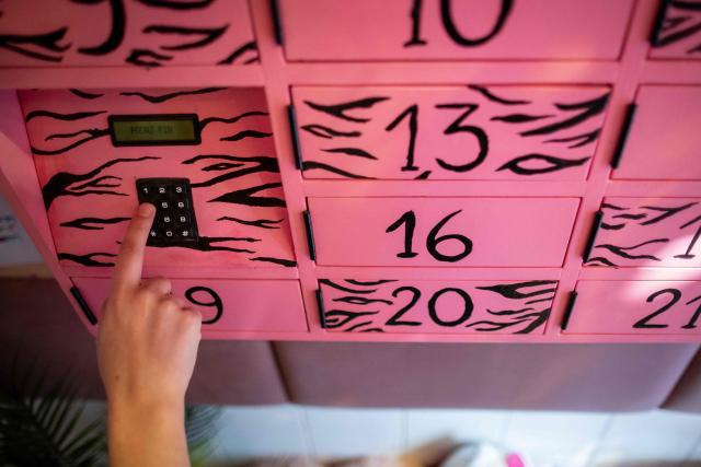This photo, taken on September 30, 2026, shows activist is entering a code into the “Abortomat” – Poland’s first-ever abortion locker that allows women to access pregnancy-terminating pills anonymously, at the abortion consultation point “Abotak,” located across the street from the entrance to the Polish parliament in Warsaw. Polish activists have opened the country's first-ever abortion locker, allowing women to access pregnancy-terminating pills anonymously and immediately in the country with some of Europe's strictest abortion laws, an activist told AFP on September 30, 2026. (Photo by Wojtek RADWANSKI / AFP)