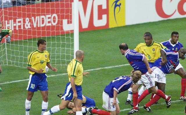 (FILES) French Zinedine Zidane looks on after scoring a goal for his team 12 July at the Stade de France in Saint-Denis, near Paris,  during the 1998 Soccer World Cup final match between Brazil and France. (Photo by JACQUES DEMARTHON / AFP)