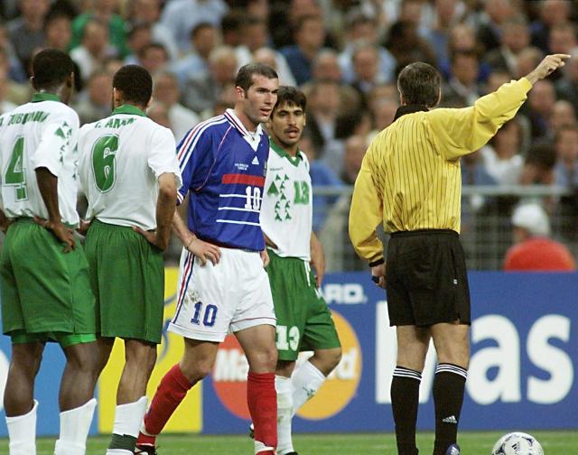 (FILES) French mid-fielder Zinedine Zidane (C) is sent off by Mexican referee Arturo P. Brizio Carter (R) 18 June at Stade de France in Saint-Denis, north of Paris, during the 1998 Soccer World Cup group C match between France and Saudi Arabia. France beat Saudi Arabia 4-0 to book their place in the World Cup second round but playmaker Zidane will now miss the next two games. Zidane went off for stamping Saudi captain Fuad Amin in the second half. (Photo by Gabriel BOUYS / AFP)
