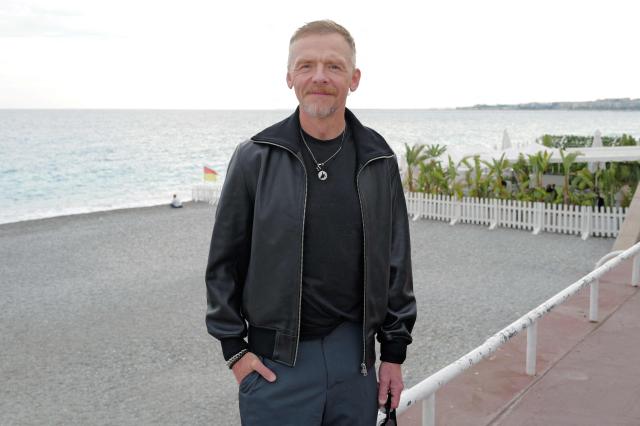 British actor Simon Pegg poses during a photocall  for the movie “Only What We Carry” at the Cineroman film festival in Nice, southeastern France on September 30, 2026. (Photo by Valery HACHE / AFP)