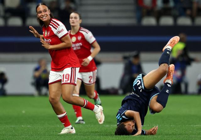 Paris FC's French defender #26 Fiona Liaigre (R) falls next to Arsenal's German forward #19 Lisa Baum during the UEFA Women's Champions League league phase Matchday 2 football match between Paris FC and Arsenal WFC at the Jean-Bouin Stadium in Paris on September 30, 2026. (Photo by FRANCK FIFE / AFP)