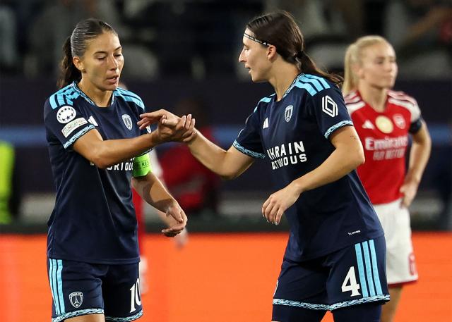 Paris FC's French forward #10 Clara Mateo (L) celebrates scoring her team's first goal during the UEFA Women's Champions League league phase Matchday 2 football match between Paris FC and Arsenal WFC at the Jean-Bouin Stadium in Paris on September 30, 2026. (Photo by FRANCK FIFE / AFP)
