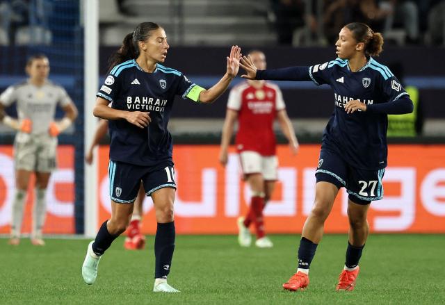 Paris FC's French forward #10 Clara Mateo (L) celebrates scoring her team's first goal during the UEFA Women's Champions League league phase Matchday 2 football match between Paris FC and Arsenal WFC at the Jean-Bouin Stadium in Paris on September 30, 2026. (Photo by FRANCK FIFE / AFP)