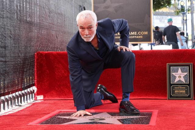 US actor Bradley Whitford places his hand on his newly unveiled Hollywood Walk of Fame star in Hollywood, California on September 30, 2026. (Photo by VALERIE MACON / AFP)