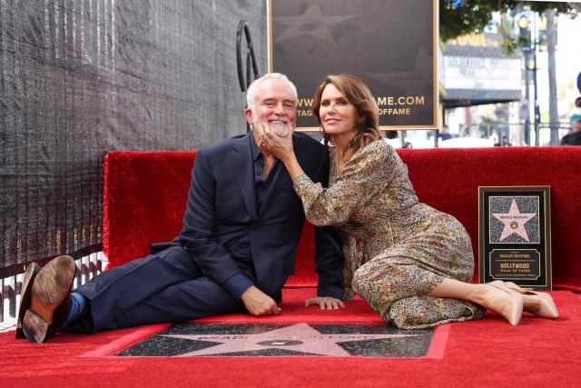US actor Bradley Whitford and wife US actress Amy Landecker pose behind Whitford's newly unveiled Hollywood Walk of Fame star in Hollywood, California on September 30, 2026. (Photo by VALERIE MACON / AFP)