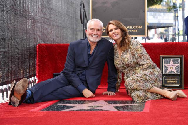 US actor Bradley Whitford and wife US actress Amy Landecker pose behind Whitford's newly unveiled Hollywood Walk of Fame star in Hollywood, California on September 30, 2026. (Photo by VALERIE MACON / AFP)