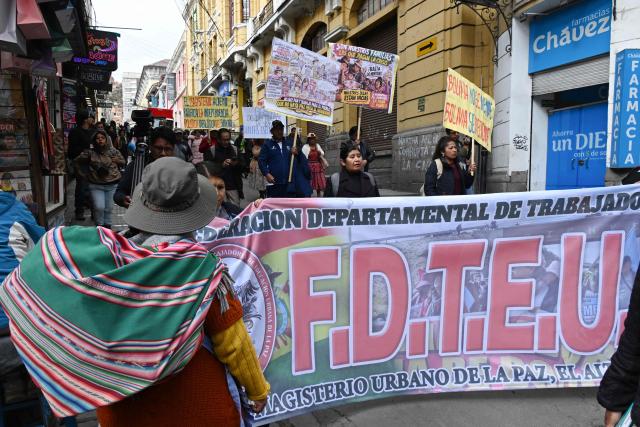 Education workers take part in a protest march through the streets of La Paz, Bolivia, on September 30, 2026. Teachers are demanding wage increases in line with the rising cost of the basic food basket and the repeal of decrees that, according to their union, have affected their economic situation. (Photo by Aizar RALDES / AFP)