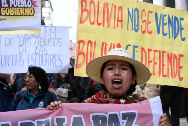 A demonstrator chants slogans during a protest march by education workers in La Paz, Bolivia, on September 30, 2026. Teachers are demanding wage increases in line with the rising cost of the basic food basket and the repeal of decrees that, according to their union, have affected their economic situation. (Photo by Aizar RALDES / AFP)