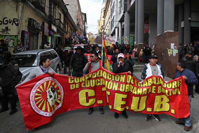 Education workers take part in a protest march through the streets of La Paz, Bolivia, on September 30, 2026. Teachers are demanding wage increases in line with the rising cost of the basic food basket and the repeal of decrees that, according to their union, have affected their economic situation. (Photo by Aizar RALDES / AFP)