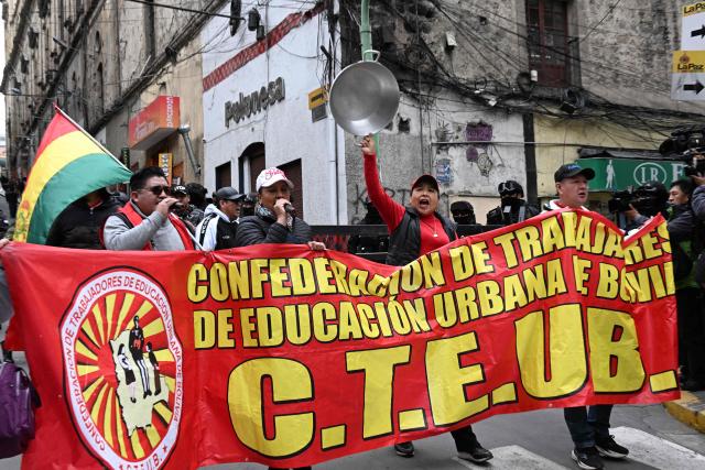Education workers take part in a protest march through the streets of La Paz, Bolivia, on September 30, 2026. Teachers are demanding wage increases in line with the rising cost of the basic food basket and the repeal of decrees that, according to their union, have affected their economic situation. (Photo by Aizar RALDES / AFP)