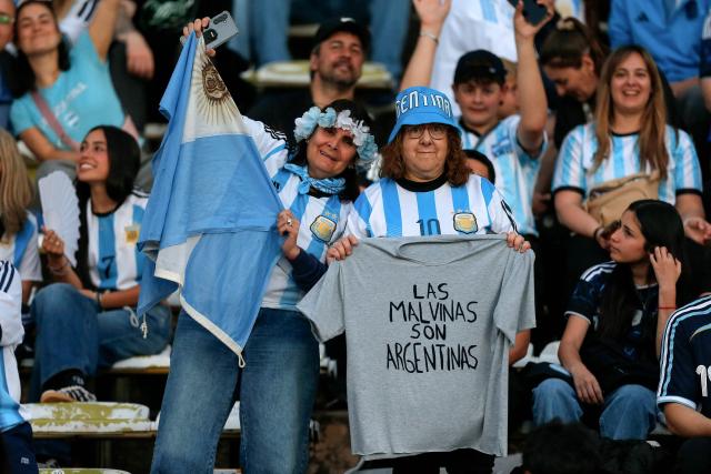 Argentine fans hold a shirt reading "The Malvinas (Falkland Islands) belong to Argentina" ahead of the international friendly football match between Argentina and Bolivia at Mario Alberto Kempes Stadium in Cordoba, Argentina, on September 30, 2026. (Photo by Diego Lima / AFP)