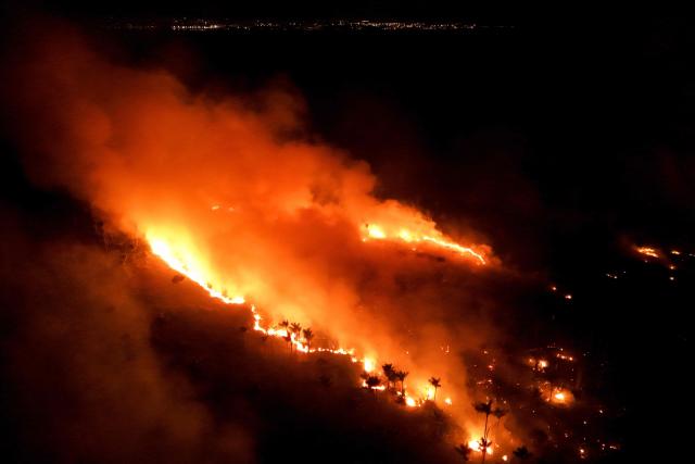 This aerial view shows a wildfire in the Amazon rainforest in Iranduba, Amazonas state, Brazil on September 30, 2026. (Photo by MICHAEL DANTAS / AFP)