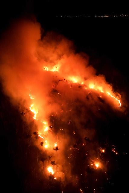This aerial view shows a wildfire in the Amazon rainforest in Iranduba, Amazonas state, Brazil on September 30, 2026. (Photo by MICHAEL DANTAS / AFP)