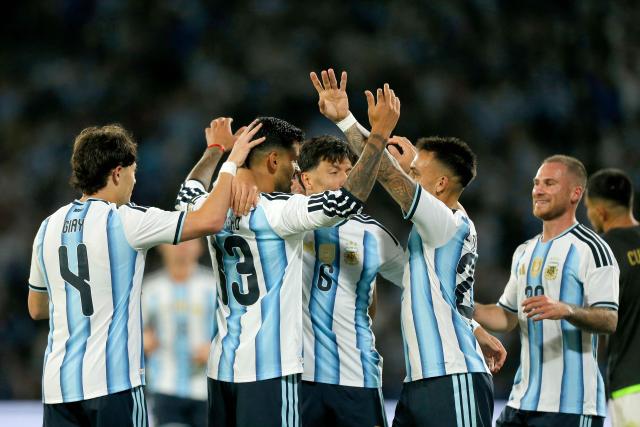 Argentina's defender #13 Cristian Romero (2nd L) celebrates with teammates after scoring his team's third goal during the international friendly football match between Argentina and Bolivia at Mario Alberto Kempes Stadium in Cordoba, Argentina, on September 30, 2026. (Photo by Diego Lima / AFP)