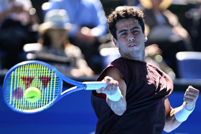 Spain's Jaume Munar plays a shot to USA's Taylor Fritz during their men's singles tennis match at the ATP Tour Japan Open Tennis Championships at the Ariake Tennis Forest Park in Tokyo on October 1, 2026. (Photo by Rie KIKUCHI / AFP)