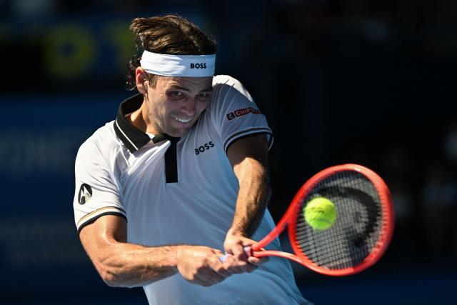 USA's Taylor Fritz plays a shot to Spain's Jaume Munar during their men's singles tennis match at the ATP Tour Japan Open Tennis Championships at the Ariake Tennis Forest Park in Tokyo on October 1, 2026. (Photo by Rie KIKUCHI / AFP)