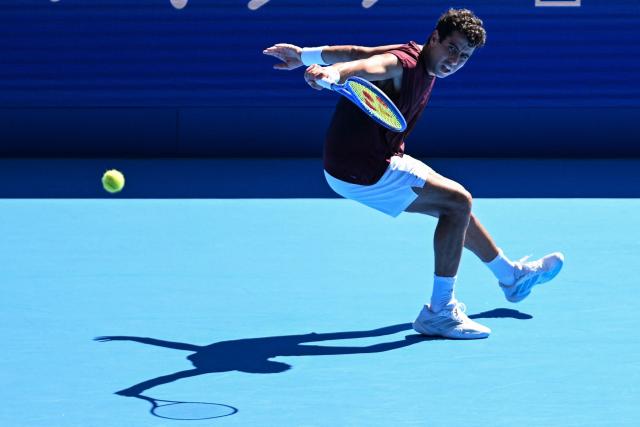 Spain's Jaume Munar plays a shot to USA's Taylor Fritz during their men's singles tennis match at the ATP Tour Japan Open Tennis Championships at the Ariake Tennis Forest Park in Tokyo on October 1, 2026. (Photo by Rie KIKUCHI / AFP)