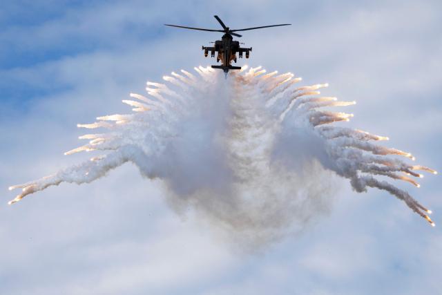 A South Korean Apache AH-64E helicopter takes part in the 78th Armed Forces Day at a military base in Gyeryong on October 1, 2026. (Photo by JEON HEON-KYUN / POOL / AFP)