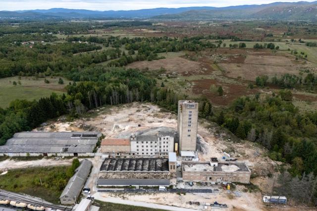 Aerial view shows the former PPK Velebit agro-food industrial complex and its silo where waste was illegally dumped and buried in Gospic, Croatia's Lika region, on September 21, 2026. As Croatia prepares to clean up tens of thousands of tonnes of hazardous waste dumped in the heart of its idyllic Lika region, locals fear years of illegal dumping may have spread into its pristine surrounds. (Photo by MARKO PERKOV / AFP)