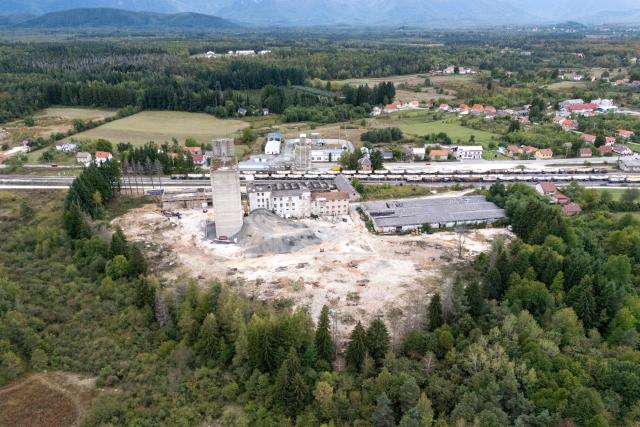 Aerial view shows the former PPK Velebit agro-food industrial complex and its silo where waste was illegally dumped and buried in Gospic, Croatia's Lika region, on September 21, 2026. As Croatia prepares to clean up tens of thousands of tonnes of hazardous waste dumped in the heart of its idyllic Lika region, locals fear years of illegal dumping may have spread into its pristine surrounds. (Photo by MARKO PERKOV / AFP)