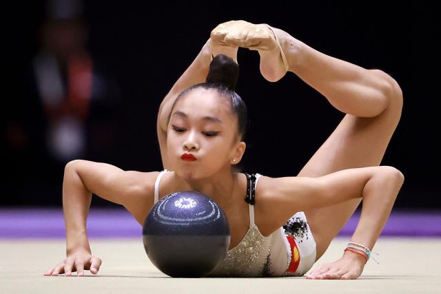 Kyrgyzstan’s Asel Arapova competes in the individual ball of the rhythmic gymnastics qualification round during the 2026 Asian Games at the Nagoya General Gymnasium in Nagoya on October 1, 2026. (Photo by DAVID GRAY / AFP)