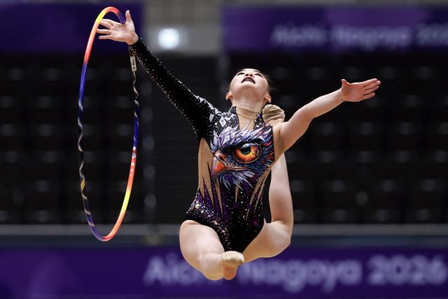 Thailand’s Sikharee Sutthiragsa competes in the individual hoop of the rhythmic gymnastics qualification round during the 2026 Asian Games at the Nagoya General Gymnasium in Nagoya on October 1, 2026. (Photo by DAVID GRAY / AFP)