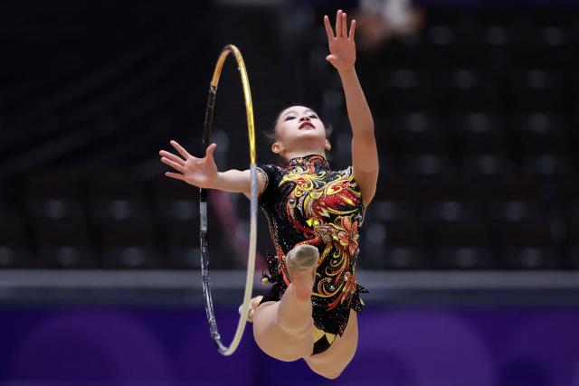 Thailand’s Sitanan Eakbunnasing competes in the individual hoop of the rhythmic gymnastics qualification round during the 2026 Asian Games at the Nagoya General Gymnasium in Nagoya on October 1, 2026. (Photo by DAVID GRAY / AFP)